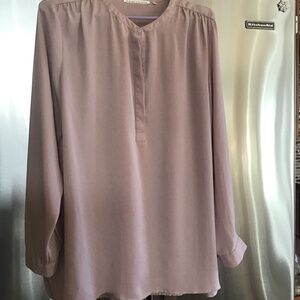 Woman’s sheer dusty pink blouse